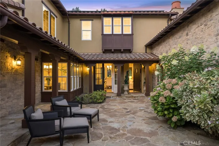 front courtyard with outdoor fireplace