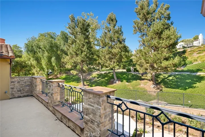 wrought iron accents & abundant natural light create an elegant ambiance
