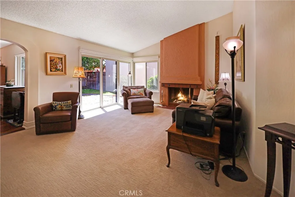 Spacious living room filled with natural light, offering flexible space for relaxing or entertaining