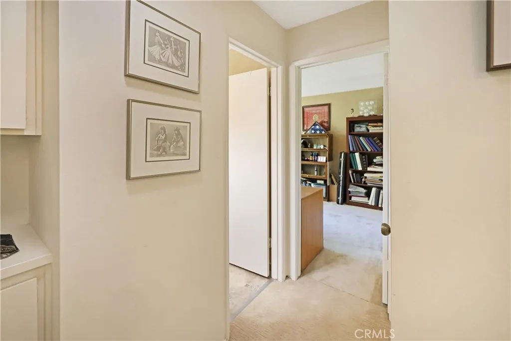 Hallway connecting the living spaces and bedrooms with a bright, open feel
