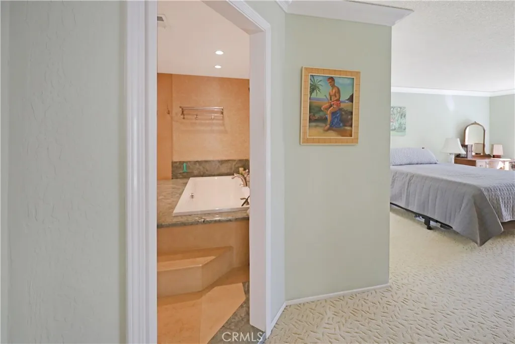 Convenient bathroom located near the primary bedroom with easy access.