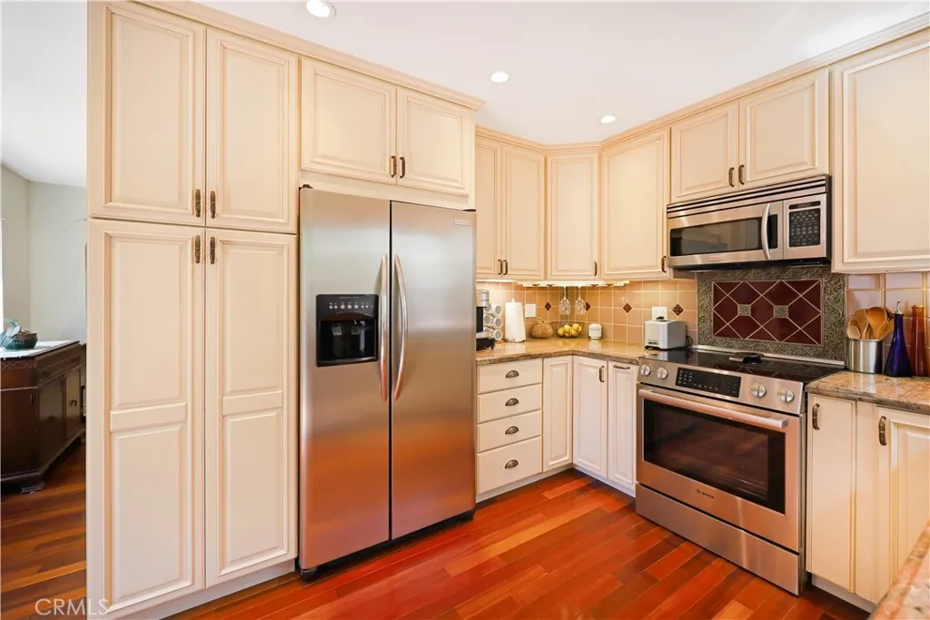 Additional kitchen view highlighting extensive cabinetry, generous counter space, and functional layout.