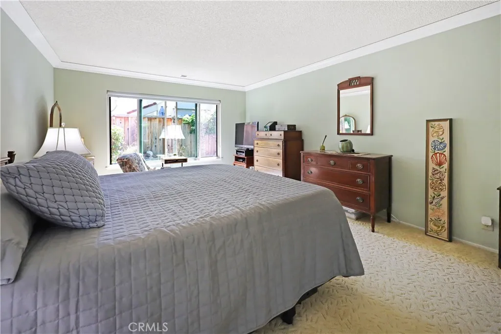 Bright bedroom with generous proportions and views to the backyard