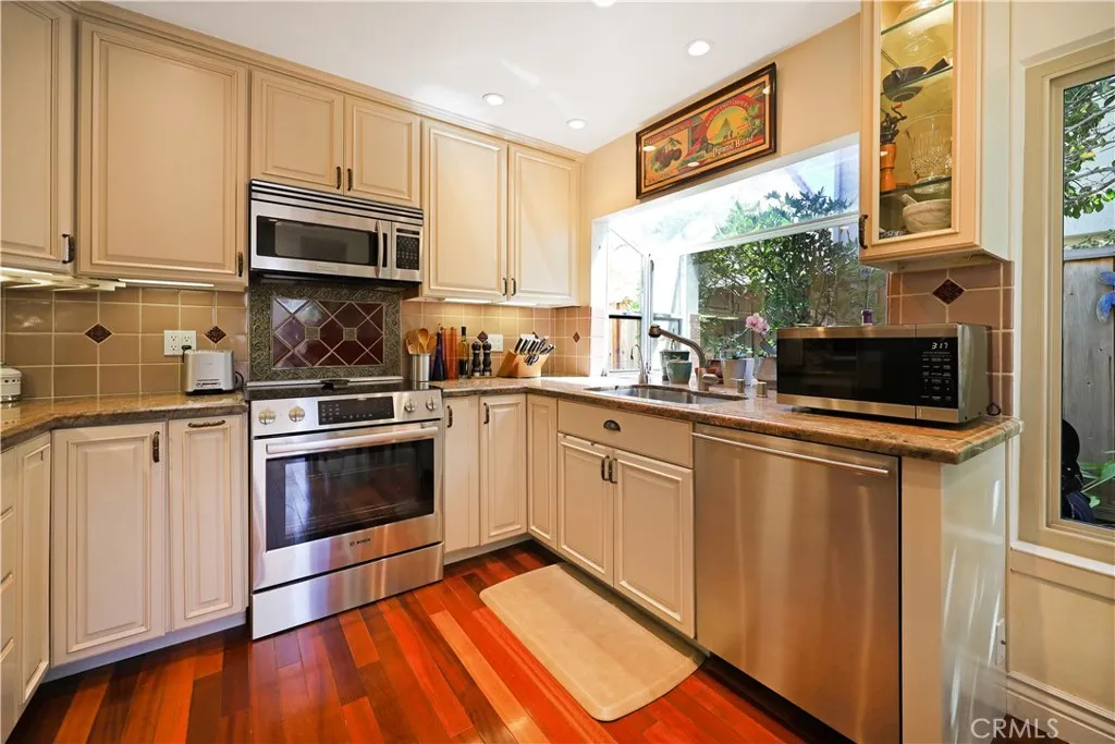 Well-appointed kitchen with abundant cabinet storage, quality appliances, and ample workspace