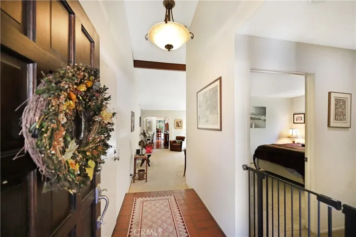 Bright foyer featuring vaulted ceilings and an inviting first impression as you enter the home