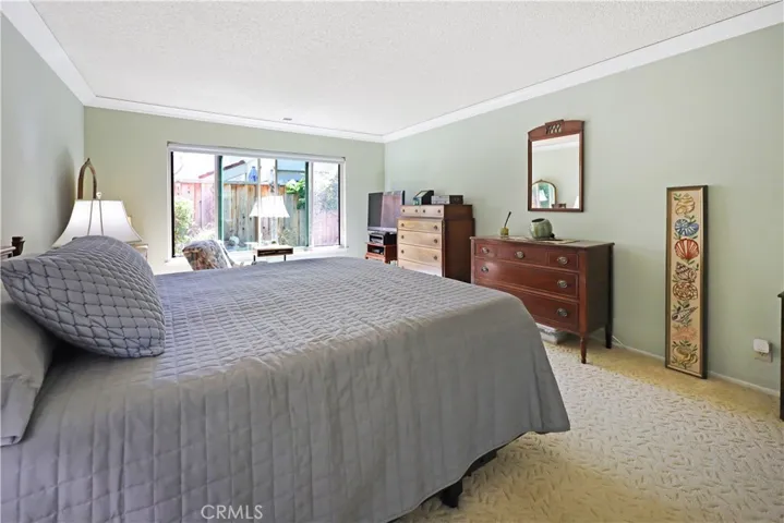 Bright bedroom with generous proportions and views to the backyard