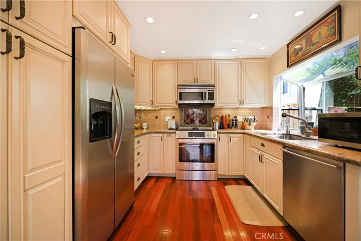 Bright kitchen offering a practical design with plenty of prep space and natural light
