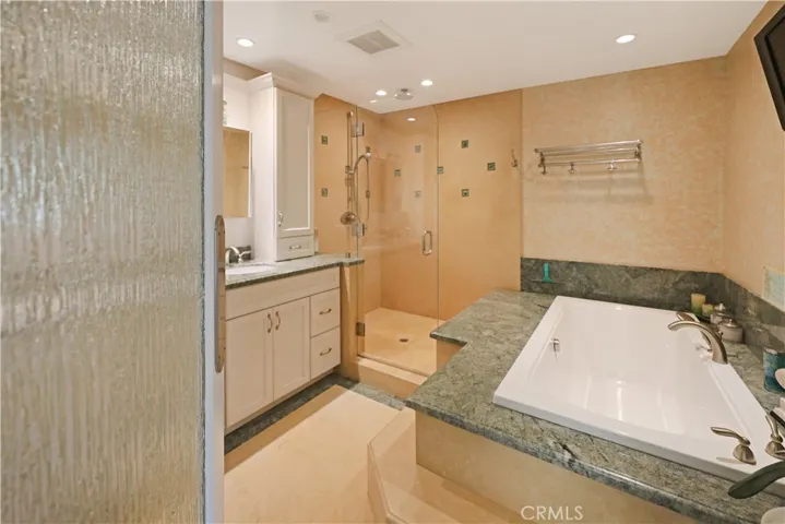 Relaxing bathroom retreat featuring a soaking tub and separate shower
