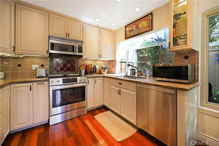 Well-appointed kitchen with abundant cabinet storage, quality appliances, and ample workspace