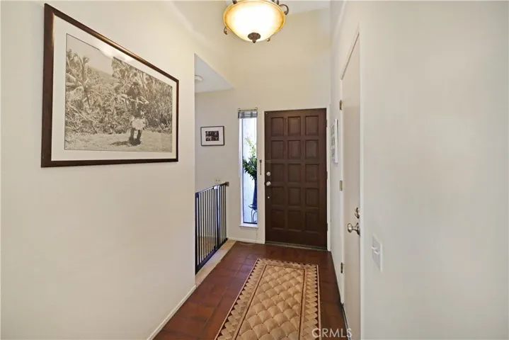 Inviting entry hall with attractive flooring and a welcoming transition into the home's main living areas.