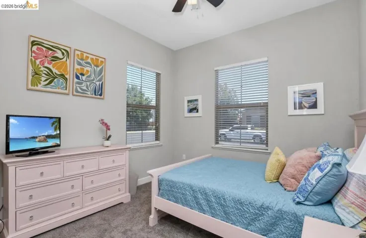 Light gray wall color complementing the gray carpet flooring