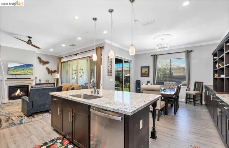 Kitchen island with granite countertop and stainless steel sink
