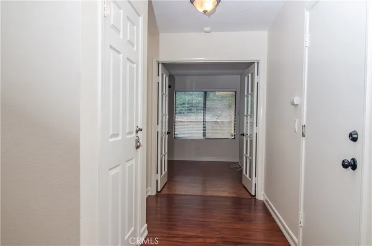 Entry hallway to guest bathroom and bedroom / office 1