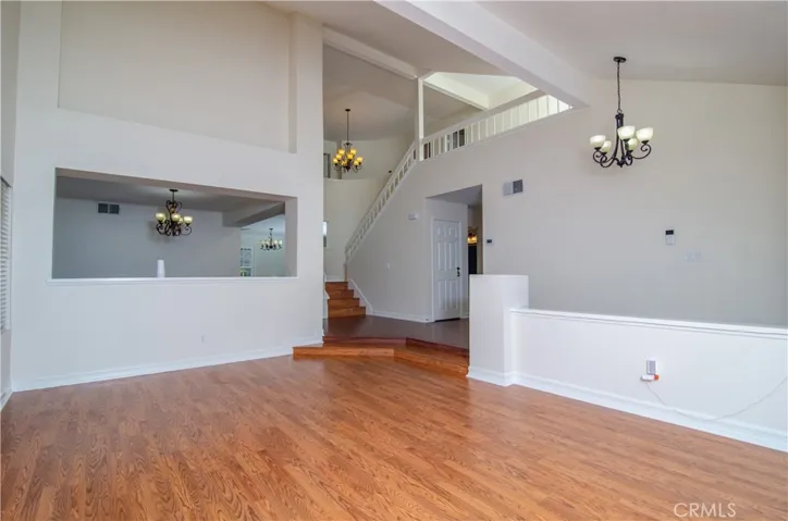 Living area and pony wall to dining area - original