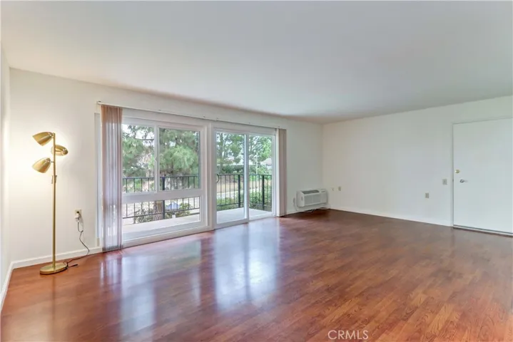 LIVING ROOM WINDOW & DOORS TO BALCONY