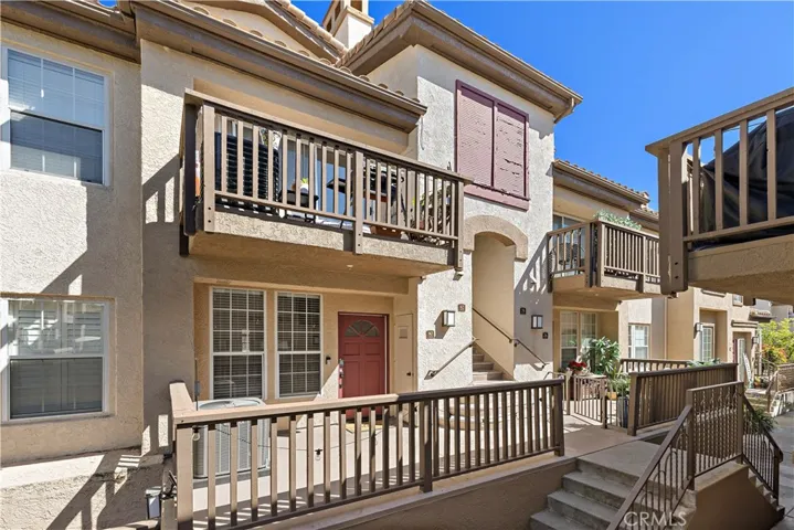Front of property and balcony
