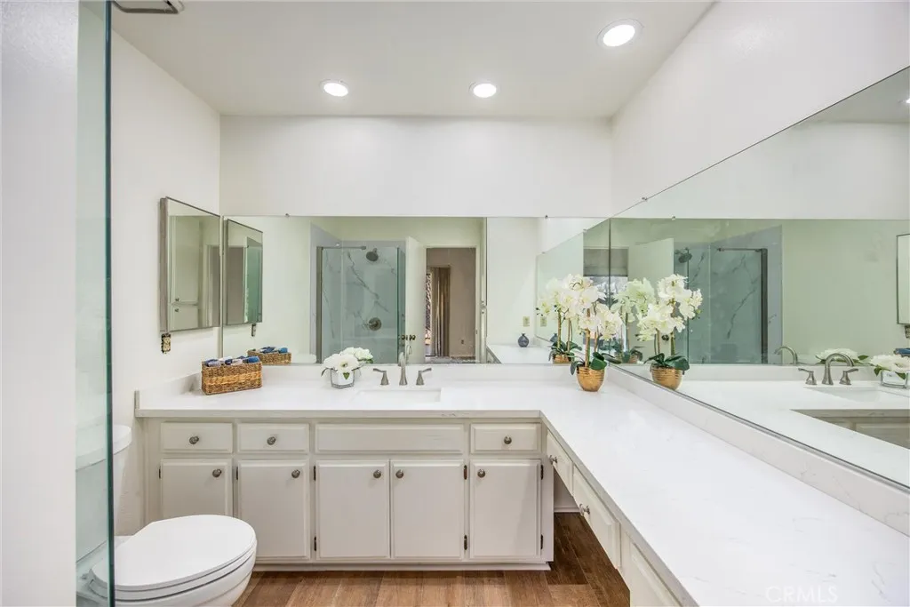 Spacious primary bathroom with an extended dual-sink vanity and generous counter space