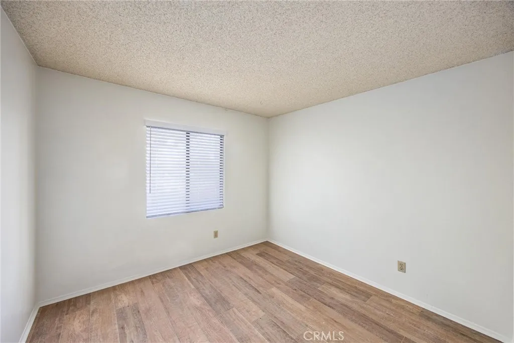 Well-sized secondary bedroom with a bright window and versatile space