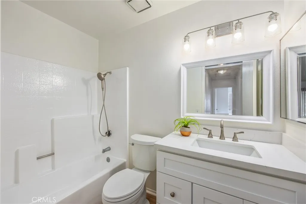 Updated secondary bathroom with a modern vanity and tub/shower combination