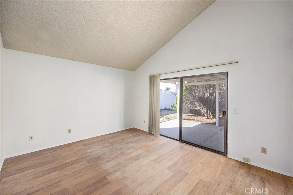 Spacious primary bedroom with direct access to the covered patio