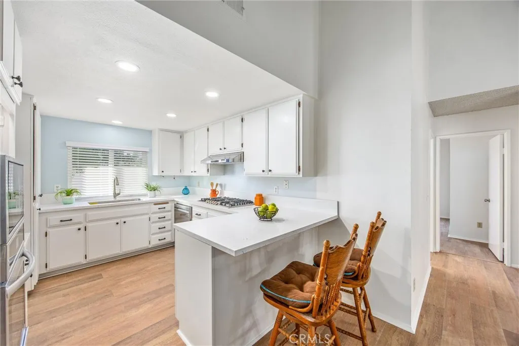 Convenient breakfast bar opens to the living areas