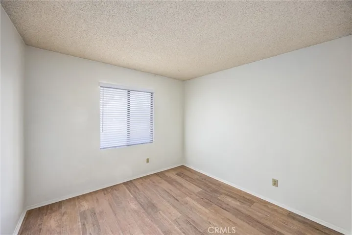 Well-sized secondary bedroom with a bright window and versatile space