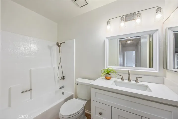 Updated secondary bathroom with a modern vanity and tub/shower combination
