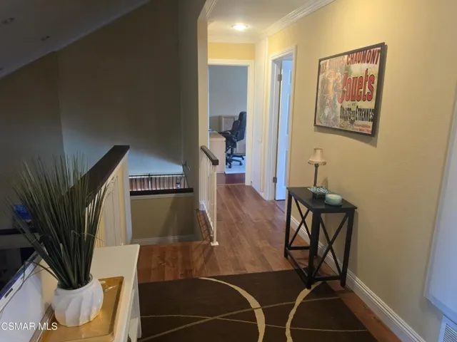 Walkway to 4 bedrooms