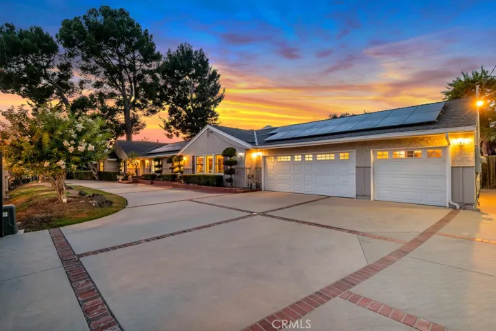 Large circular driveway with 3 car garage