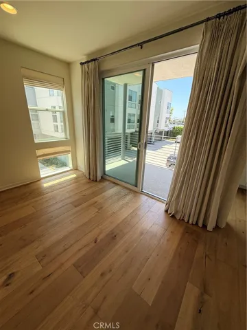 2nd floor family room looking out to patio with beautiful curtains