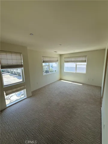 Primary Bedroom with shades, carpet and lots of space