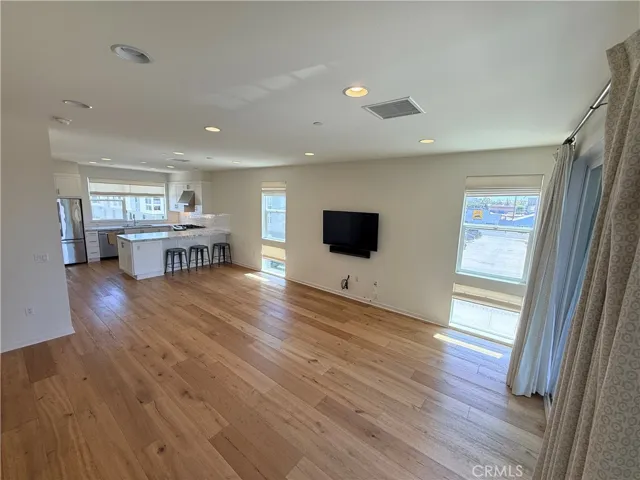 family room w/ TV, dining and kitchen