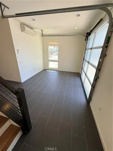 Roll up garage door to front of unit