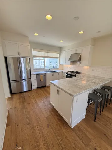 Kitchen with counter and carrera marble counters