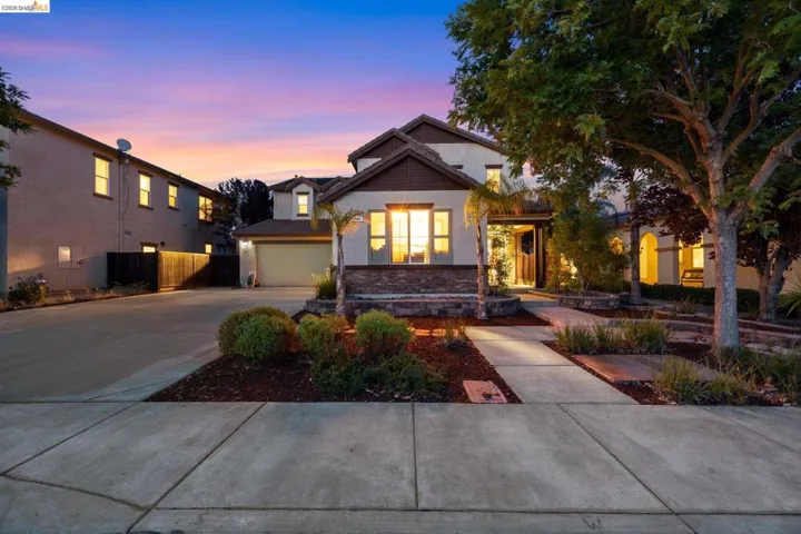 Contemporary two-story residence with a stone and stucco facade