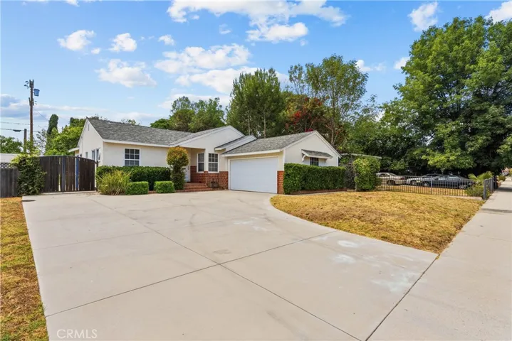 Handsome curb appeal with concrete driveway and two car attached garage