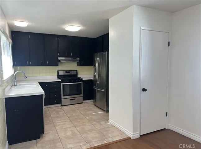 Functional kitchen just waiting to be remodeled! door opens to a pantry.