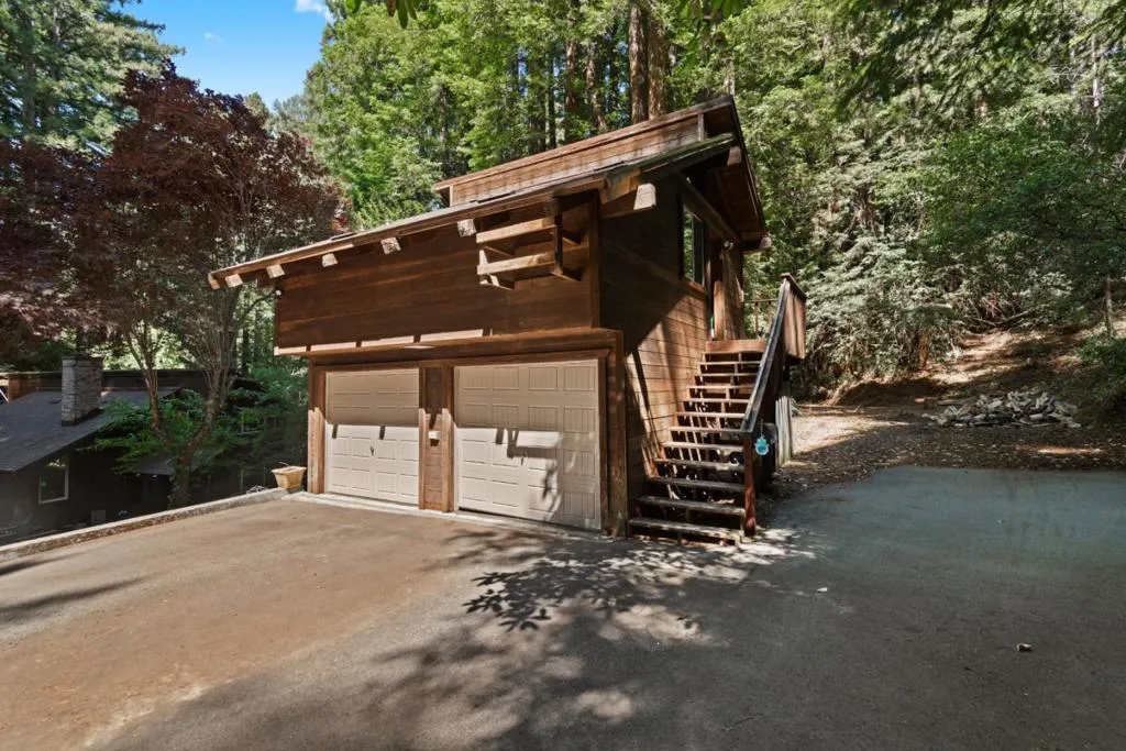 Stairs to Rental studio above garage with parking
