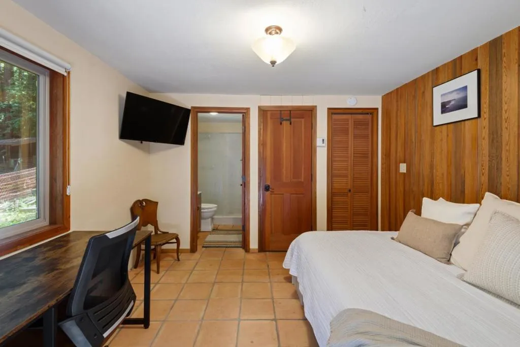 Lower level bedroom with bath and separate entrance and private deck