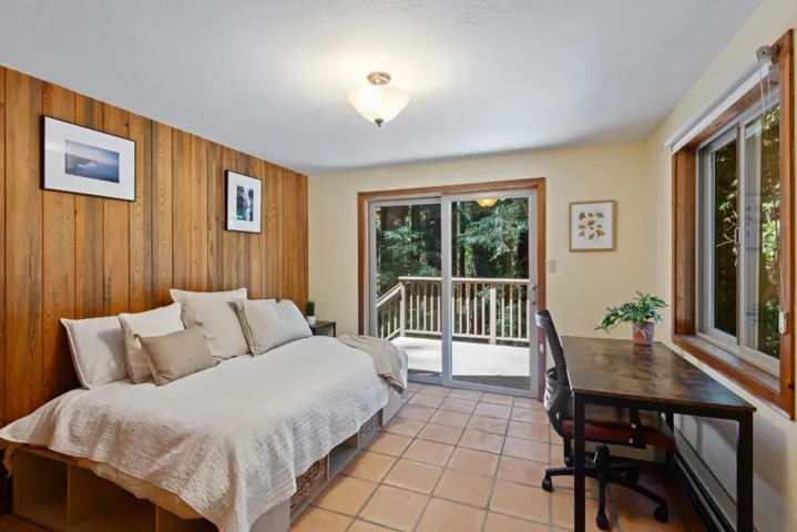 Lower level bedroom with bath and separate entrance and private deck
