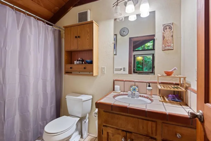 Rental studio bathroom above garage