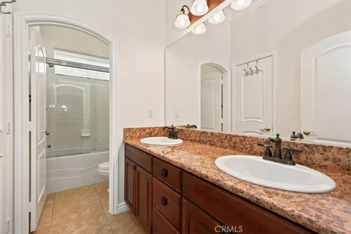 Hallway Bathroom with Dual Sinks