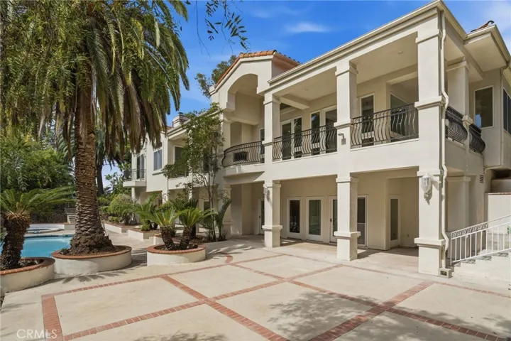 This extraordinary estate offers 5,000 square feet of luxurious living space on a half-acre lot. Expansive outdoor space is private and ideal for entertaining and hosting events – or just enjoy your own private boutique resort.  A home that offers the amenities and solitude of being on vacation.