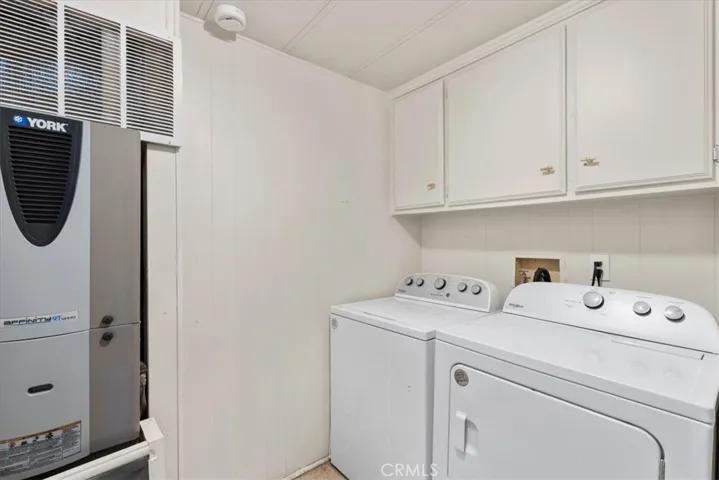Laundry room near kitchen.