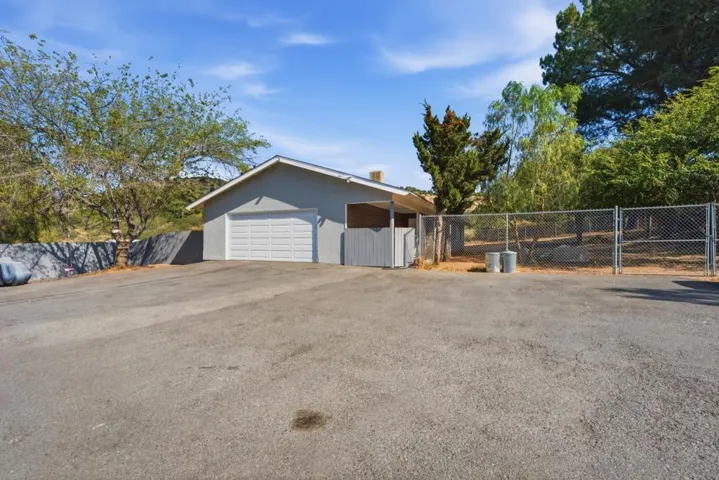 Parking, garage, and entrance to house.