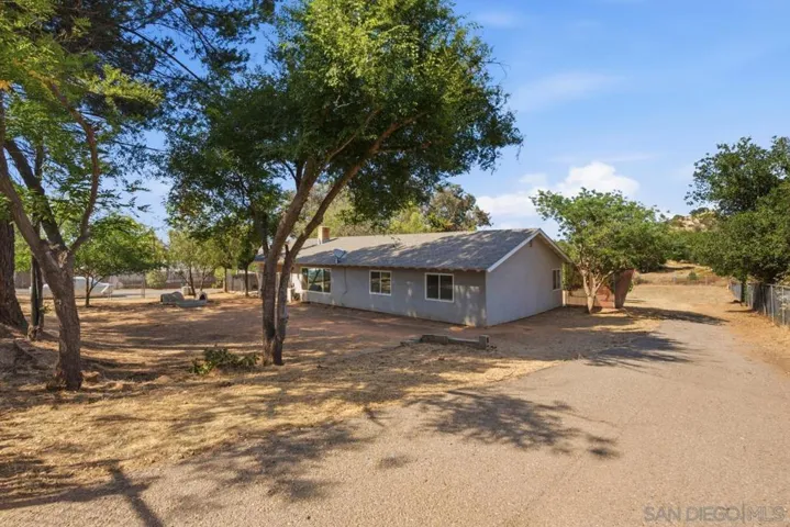 Front yard and side access to back yard.