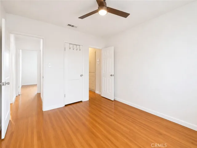 Bedroom #1 ai virtually enhanced floor clean up and painting walls white