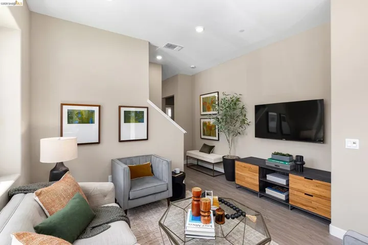 Living room with wood finished floors and recessed lighting