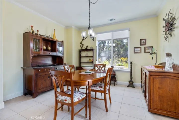 Dining Area with window overlooking the backyard gardens.