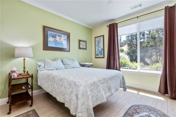 Primary Bedroom with views of the backyard gardens.
